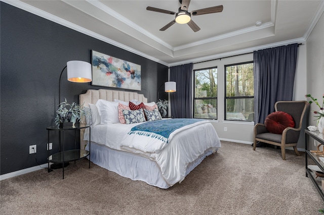 bedroom with carpet, ceiling fan, and a raised ceiling