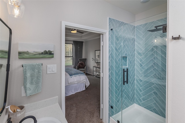 bathroom with sink, ceiling fan, crown molding, and walk in shower