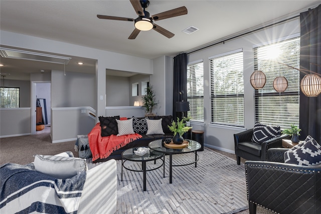 living room featuring ceiling fan and carpet floors