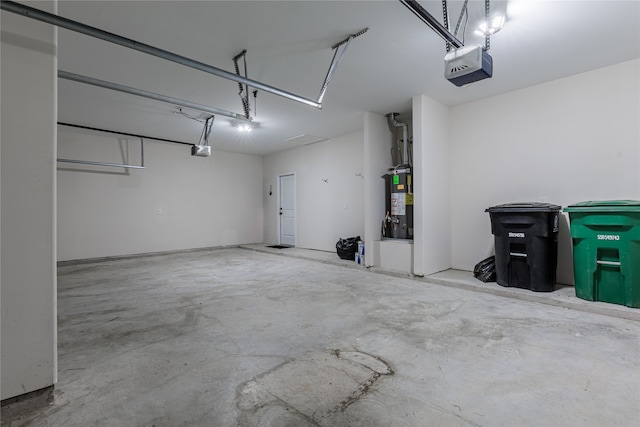 garage featuring a garage door opener and gas water heater