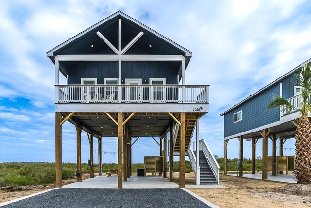 exterior space with a carport and a deck