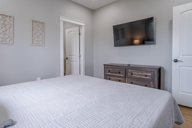 bedroom featuring wood-type flooring