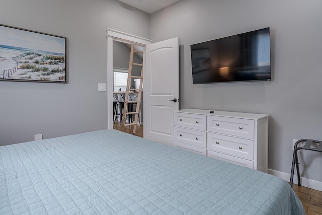 bedroom featuring dark hardwood / wood-style flooring