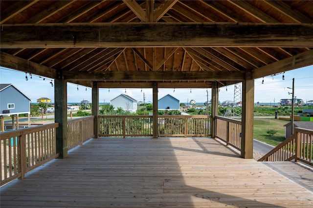 wooden terrace featuring a gazebo