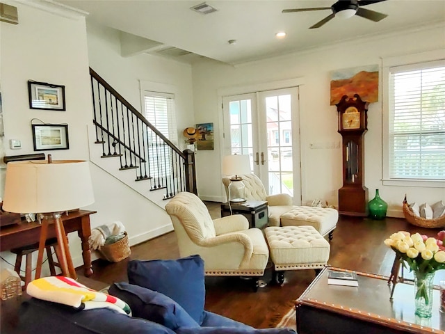 living room featuring french doors, dark wood-type flooring, and ceiling fan