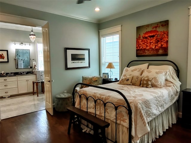 bedroom with dark hardwood / wood-style floors and crown molding