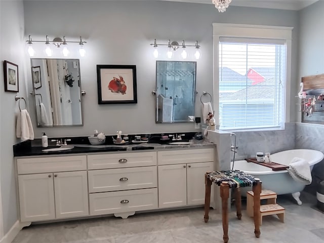 bathroom featuring tile floors, independent shower and bath, and dual vanity