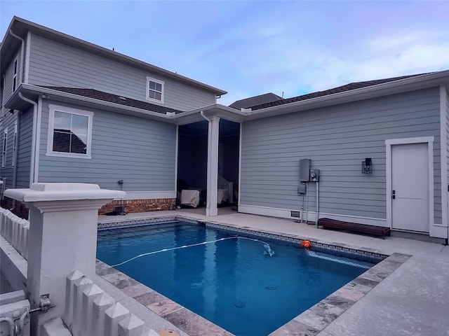 view of swimming pool featuring a patio area