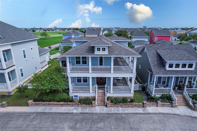 view of front of house with a balcony and a porch