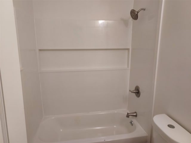 bathroom with toilet and tub / shower combination