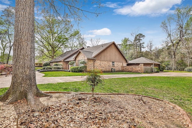 view of side of home featuring a lawn