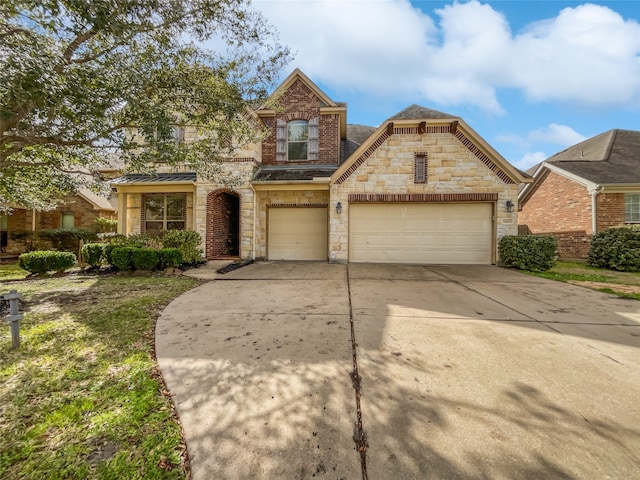 view of front of property with a garage