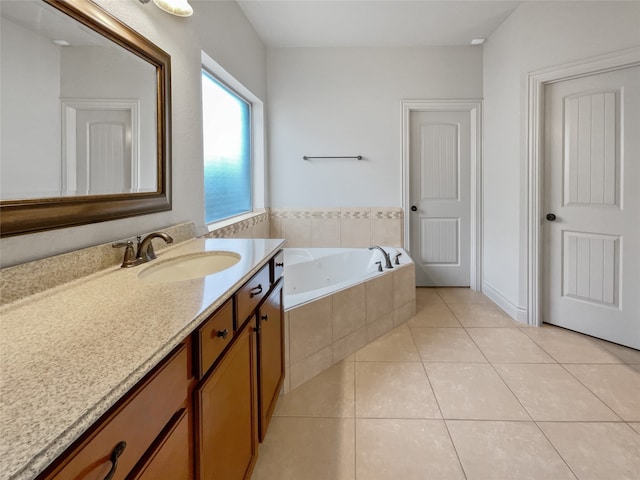 bathroom with tile floors, vanity, and a relaxing tiled bath