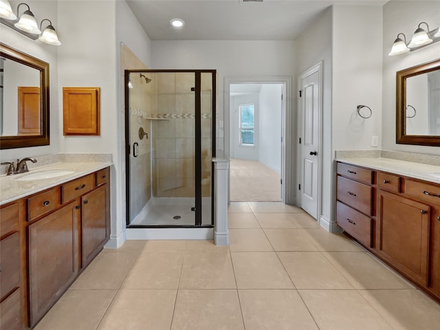 bathroom with vanity, tile floors, and walk in shower