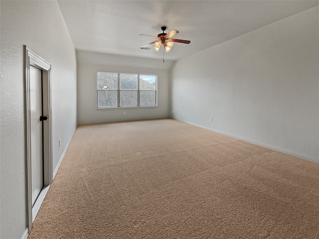 unfurnished room featuring ceiling fan and light colored carpet