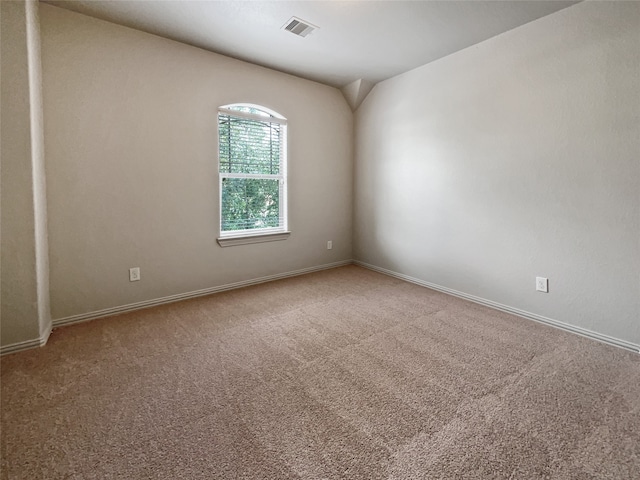 spare room featuring carpet