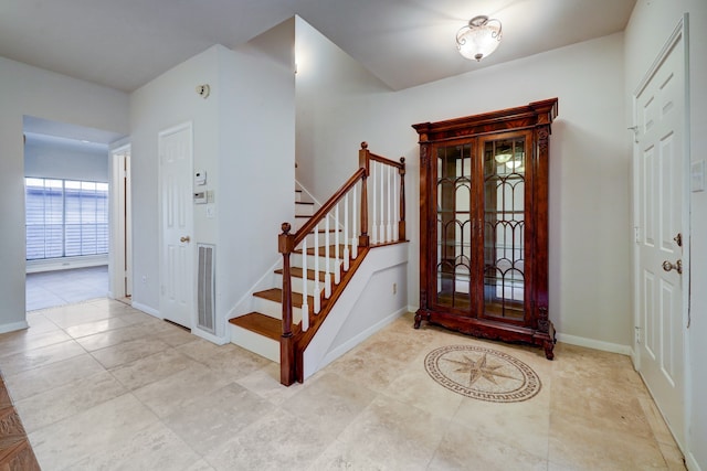 entrance foyer featuring light tile flooring