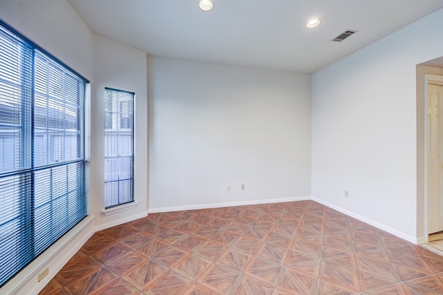 empty room with light parquet floors