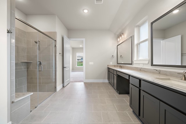 bathroom with vanity, tile patterned flooring, and a shower with door