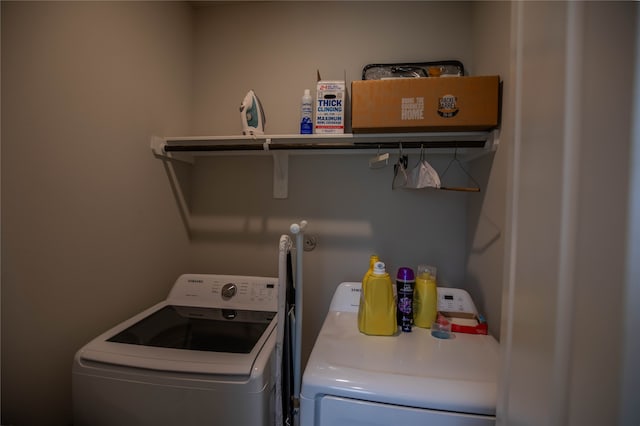 laundry room featuring washing machine and dryer