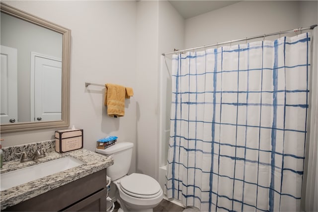 full bathroom featuring wood-type flooring, vanity, shower / bath combo with shower curtain, and toilet