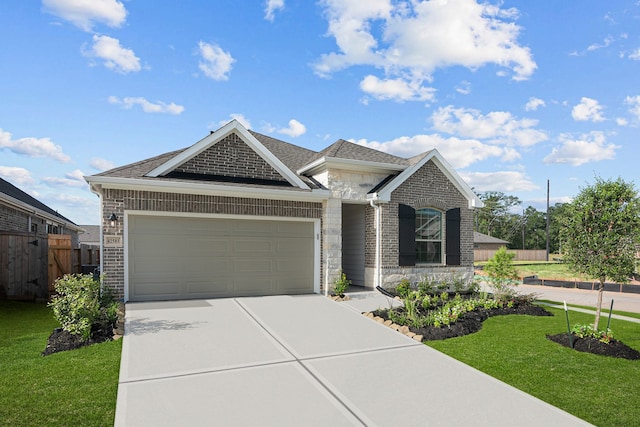 view of front facade featuring a garage and a front yard