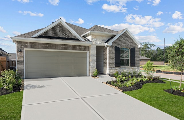 view of front facade with a garage and a front lawn