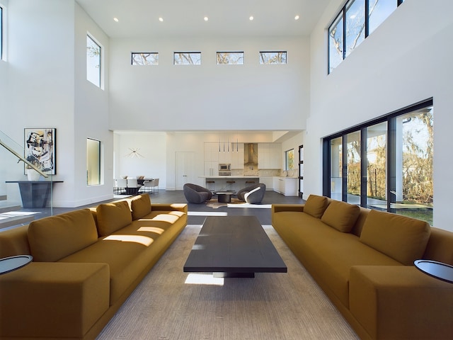 living room featuring plenty of natural light and a high ceiling