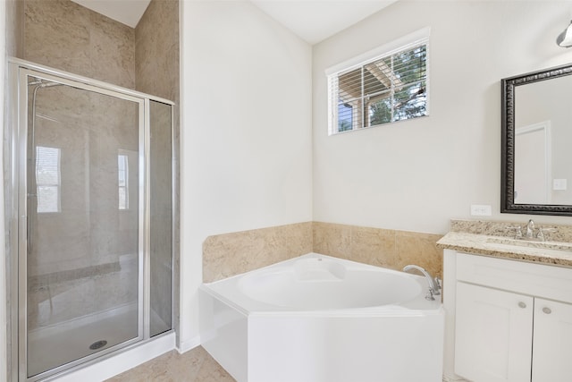 bathroom featuring plus walk in shower, tile floors, and vanity