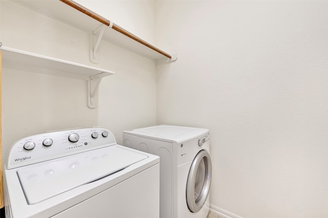 washroom featuring washer and dryer