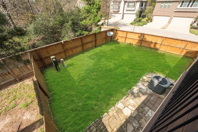 view of yard with central AC unit and a garage