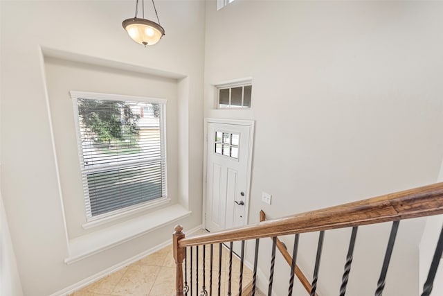 entrance foyer featuring light tile floors