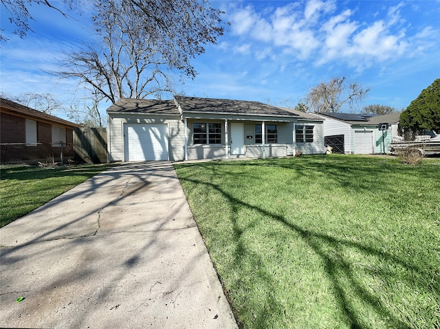 ranch-style house with a front yard and a garage