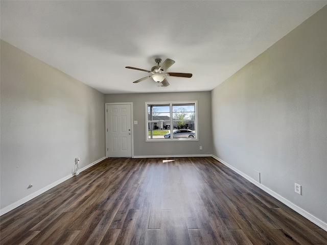 unfurnished room with dark hardwood / wood-style floors and ceiling fan