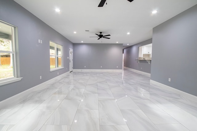 unfurnished room with ceiling fan