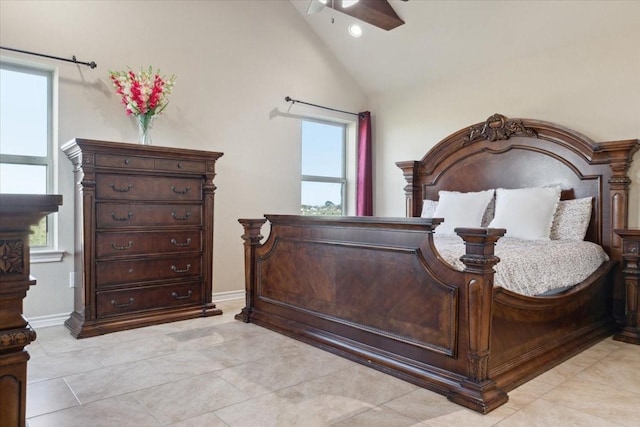 bedroom with high vaulted ceiling, ceiling fan, and light tile patterned flooring