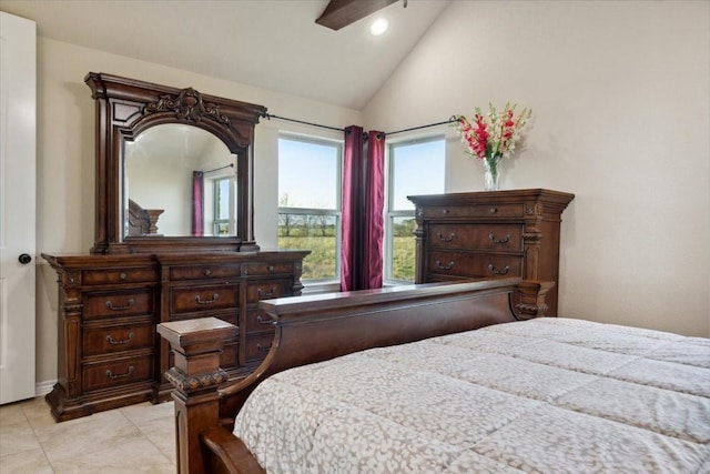 tiled bedroom with vaulted ceiling and ceiling fan