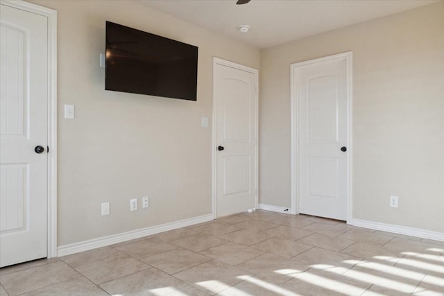 unfurnished bedroom featuring light tile patterned floors