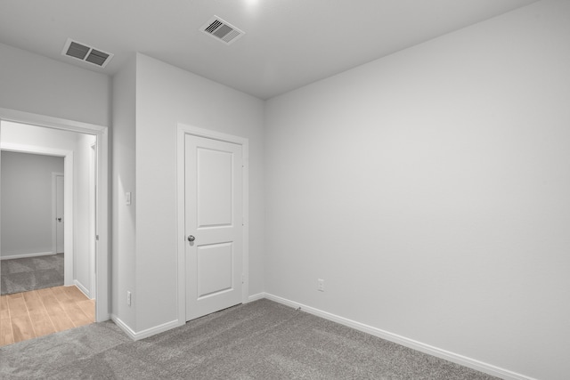 spare room featuring carpet flooring