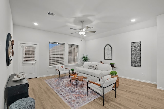 living room with ceiling fan and light wood-type flooring