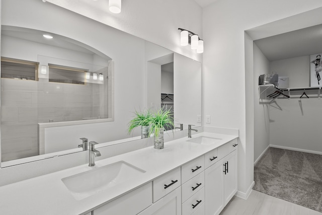 bathroom with a shower and vanity