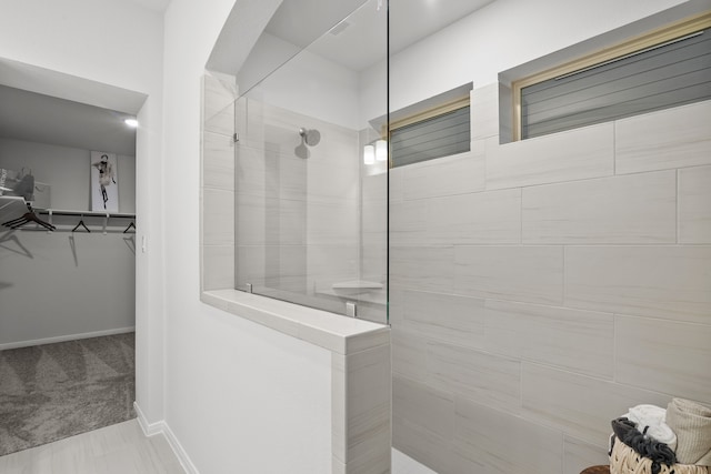 bathroom featuring a tile shower