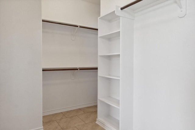 walk in closet featuring light tile patterned floors