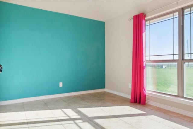 empty room with light tile patterned floors