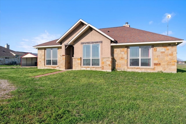 rear view of house featuring a lawn