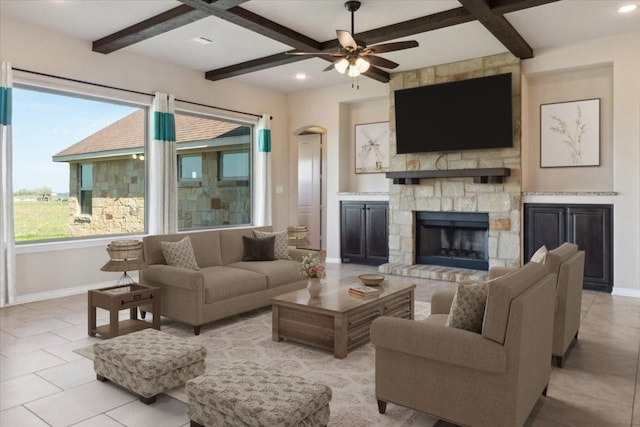 tiled living room with beam ceiling, a fireplace, and coffered ceiling