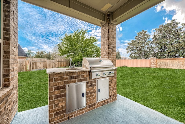 view of terrace with area for grilling and grilling area