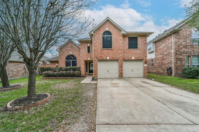 view of front property featuring a front yard and a garage