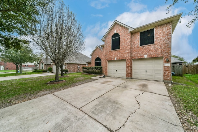 front of property with a front yard and a garage