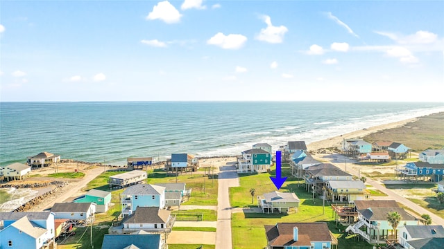 bird's eye view featuring a beach view and a water view